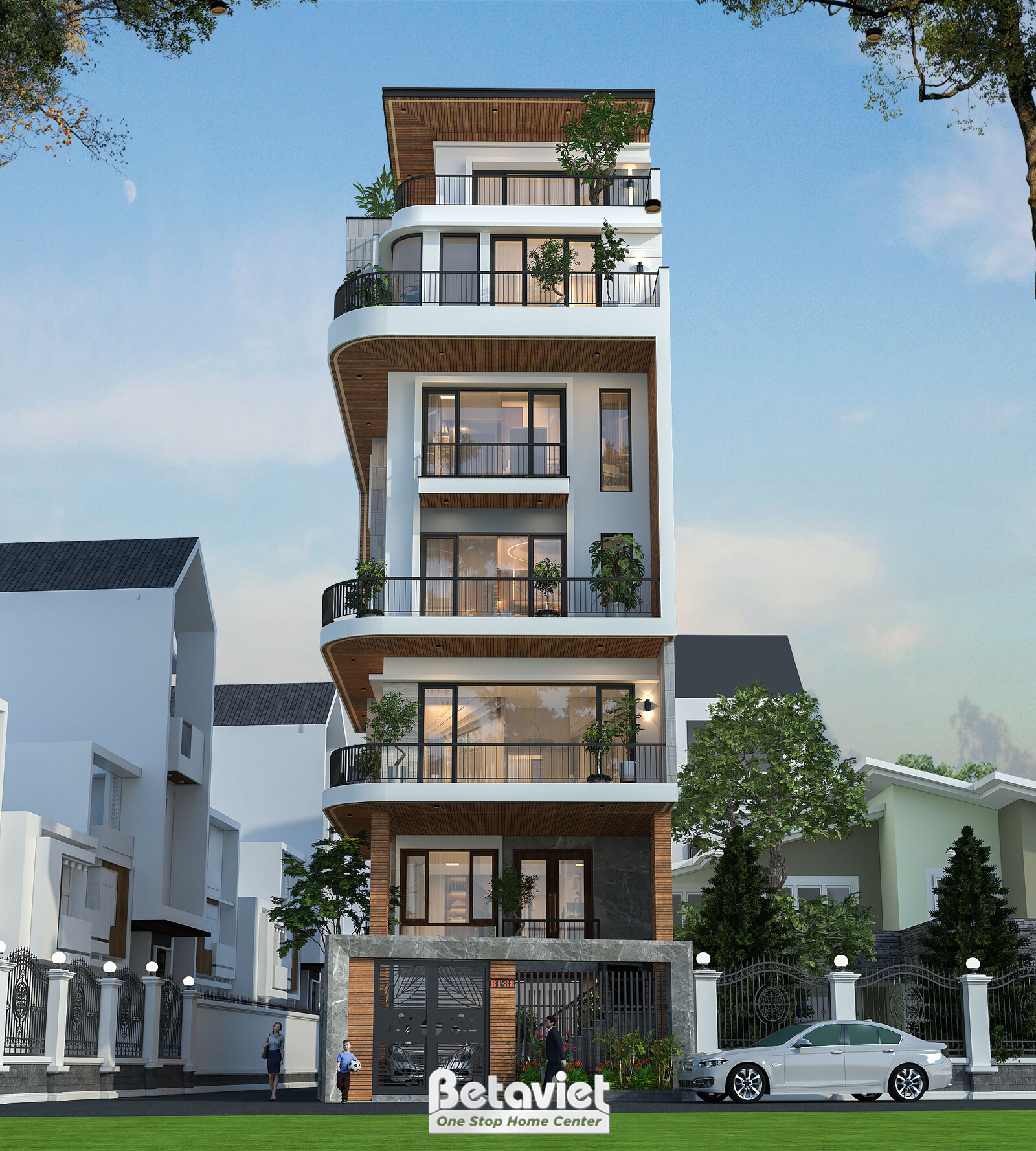 Mặt tiền nhà phố 7 tầng nhìn chính diện ban ngày, khối kiến trúc hiện đại với ban công bo cong ở các tầng trên. Tường sơn…